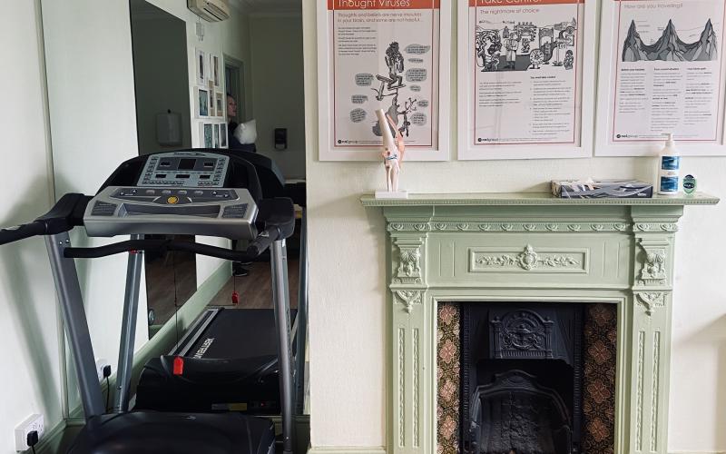 Treadmill and mirror in treatment room at White Hart Clinic Barnes