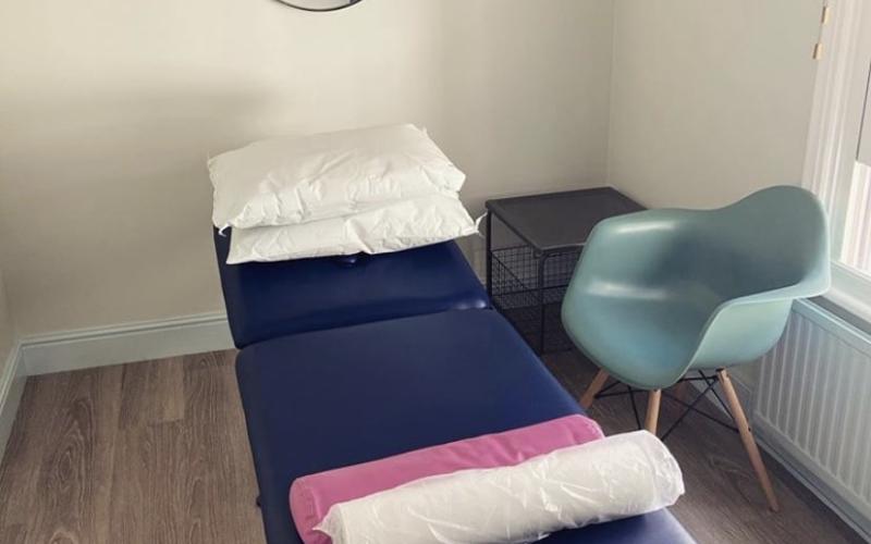 Treatment table and mirror at White Hart Clinic Barnes