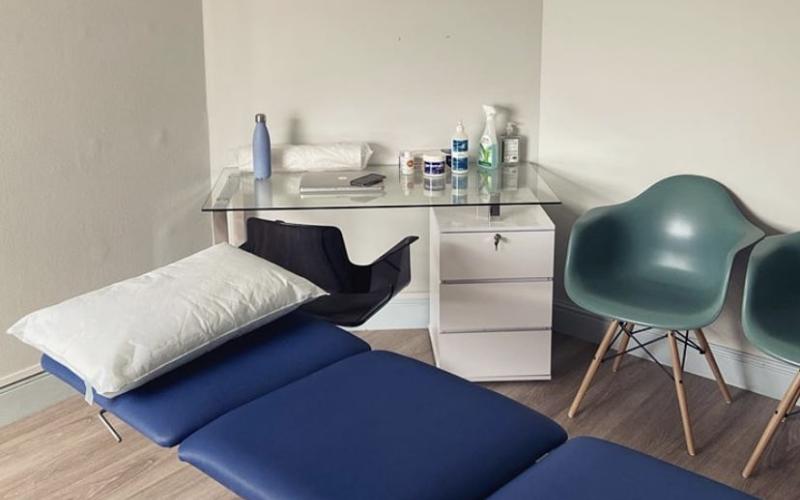 Treatment table in treatment room at White Hart Clinic Barnes